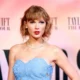 Taylor Swift slammed by 'disappointed fans' for 'shameless self-promotion' at blockbuster Eras Tour film premiere after staying silent on Israel terror that has killed 2,400