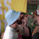 Travis Kelce downs a whiskey shot from a slice of BREAD and sings on stage with Patrick Mahomes as he lets loose at his music festival after leaving girlfriend Taylor Swift in Europe