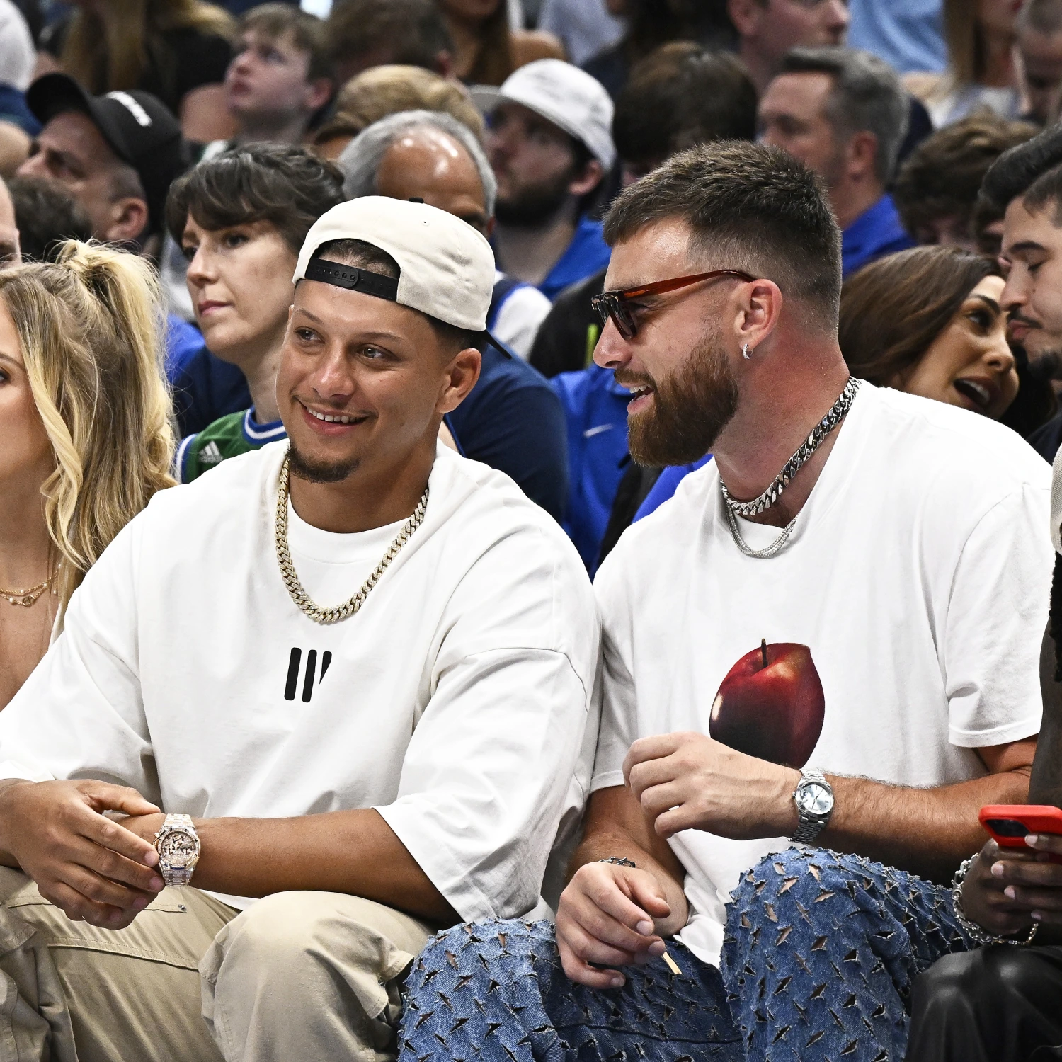 See Travis Kelce sit courtside with Patrick and Brittany Mahomes at NBA playoff game: Hear the crowd's seemingly negative reaction to the Kansas City Chiefs tight end.