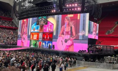 Taylor Swift thanks poncho-wearing Swifties after they waited hours in the rain at Anfield for her 100th Eras Tour show - and confirms end date for 'exhausting' record-breaking run of gigs