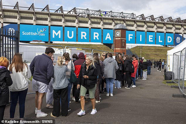 Swiftmania takes over Scotland: Taylor Swift fans skip work and queue hours for merch, sell out hotels and even rename a beauty spot after the star ahead of her first show in Edinburgh on record-breaking Eras Tour