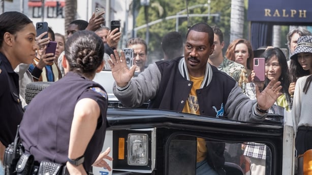 Why the 'Beverly Hills Cop" director chose to film an actual car falling off a building over using CGI: 'The stakes are real, and the danger is real.'