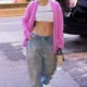 Jennifer Lopez Flaunts Her Abs in White Crop Top and Baggy Jeans During Solo N.Y.C. Outing: Lopez was spotted wearing her wedding ring with the casual attire